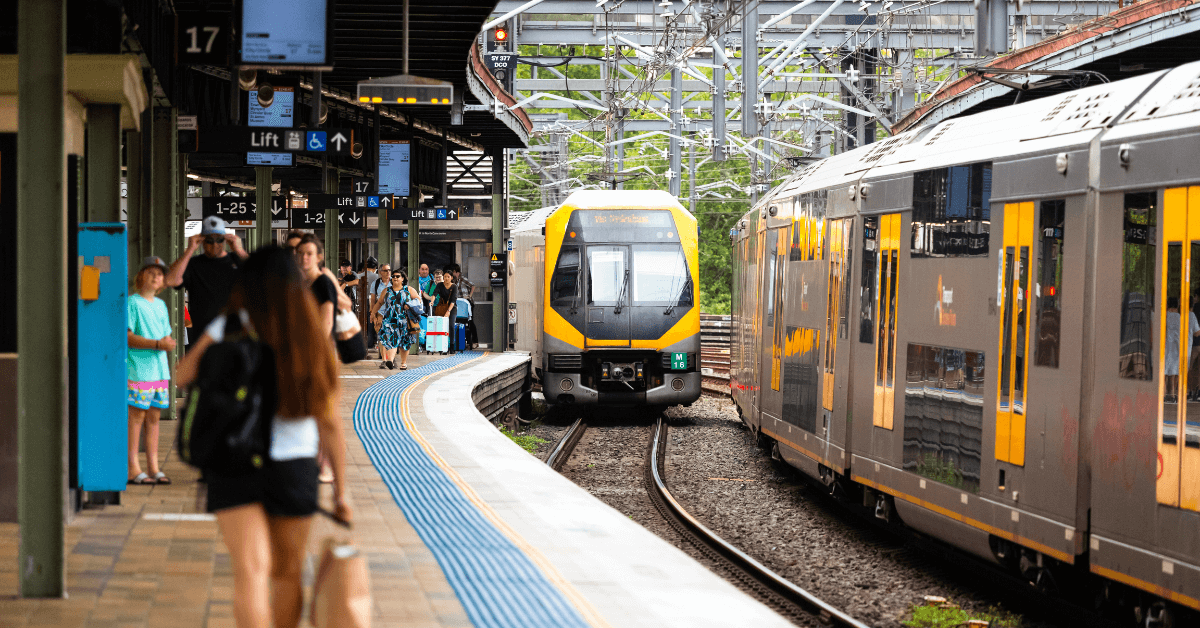 Melbourne train platform with waiting passengers and approaching train