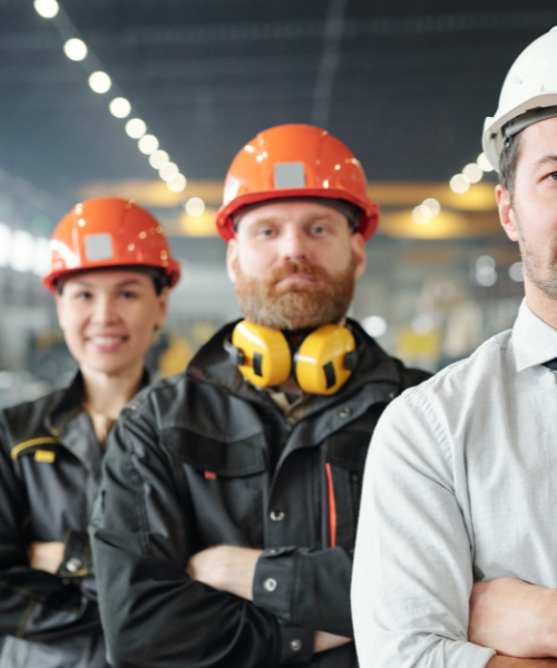 men in hard hats on workshop floor