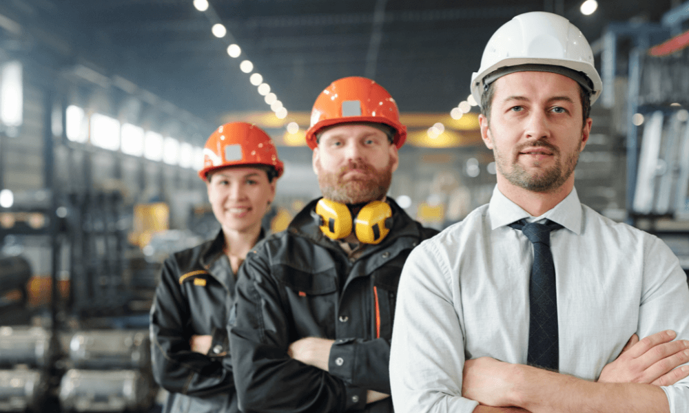 men in hard hats on workshop floor