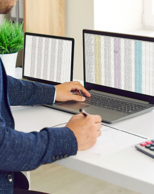 man sitting in excel spreadsheets for business reporting